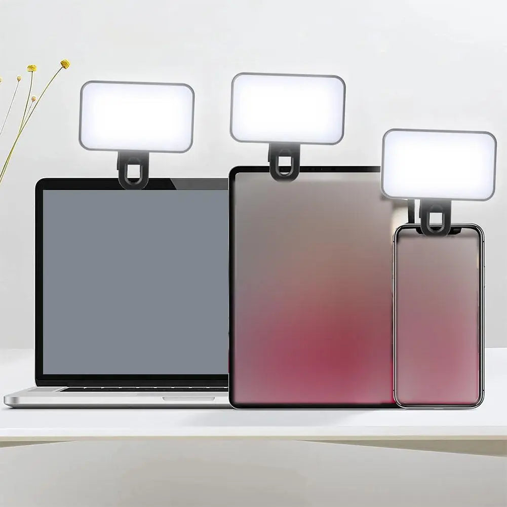 Pocket video light clipped to a phone, tablet and laptop; devices are not included