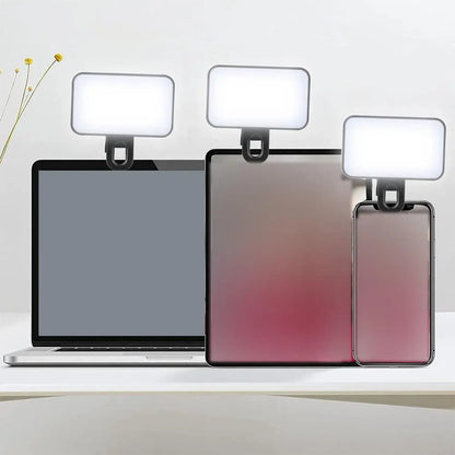Pocket video light clipped to a phone, tablet and laptop; devices are not included